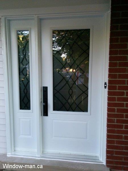 Single front door one sidelight. Entry steel insulated.  Three quarters glass. Oak Ridge iron glass design